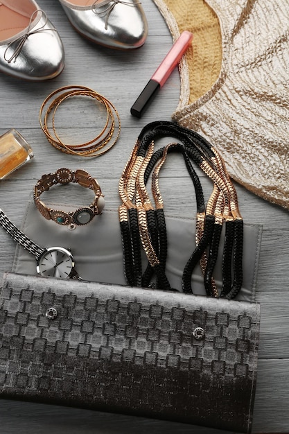 A close-up shot of various Shein accessories, including sparkling jewelry, elegant clutches, and stylish belts. The accessories are arranged on a velvet surface, showcasing their intricate details and festive appeal.