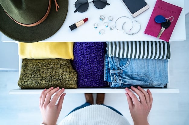 A close-up shot of various clothing items that are ideal for layering. It includes a thin merino wool base layer, a flannel shirt, a quilted vest, and a lightweight waterproof jacket. The focus is on the textures and materials of each piece.