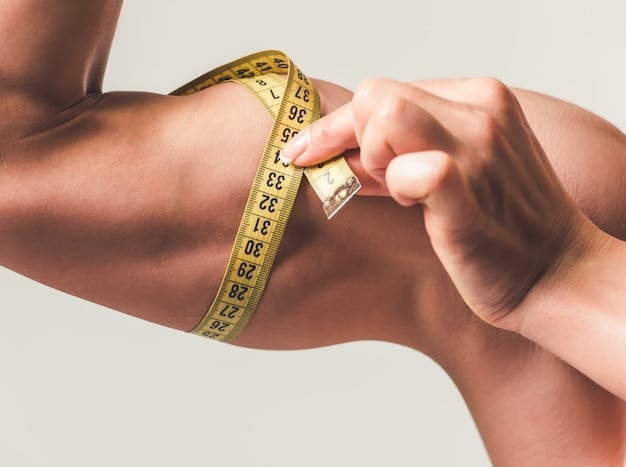 A close-up of a person using a measuring tape to measure their waist. The focus is on the tape measure and the person's waistline.