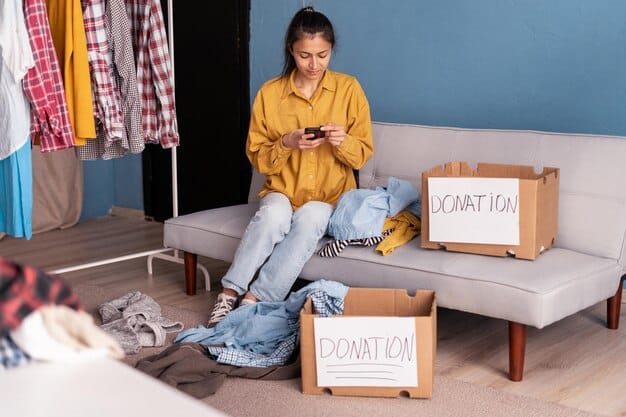 A person holding a clothing package and a return label, with a laptop showing an online store's website in the background. The scene suggests the process of returning an online purchase.