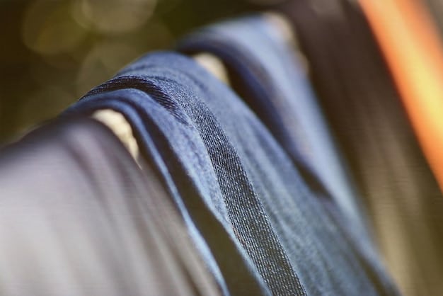 Close-up shot of various sustainable fabrics like recycled denim, organic cotton, and plant-based leather. The textures and colors of the fabrics are highlighted, showcasing their natural and eco-friendly qualities.