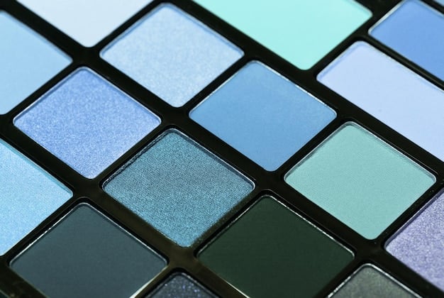 A close-up shot of a color palette featuring the trendy colors for Winter 2025: deep burgundy, camel, terracotta, ice blue, emerald green, and anthracite grey. The palette should be artistically arranged with fabric swatches and paint samples.