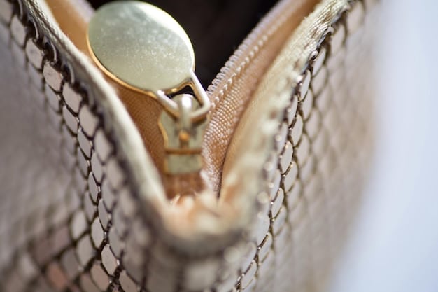 A macro shot of a Shein necklace clasp, showing the wear and tear of the plating, with some of the base metal showing through. This should highlight the potential durability issues with the jewelry materials.